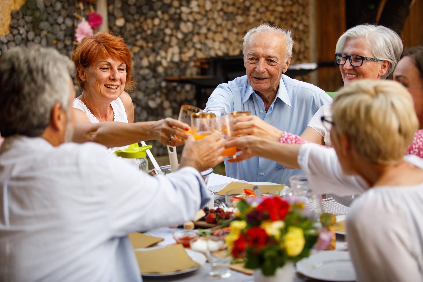 Residents raising a toast over dinner