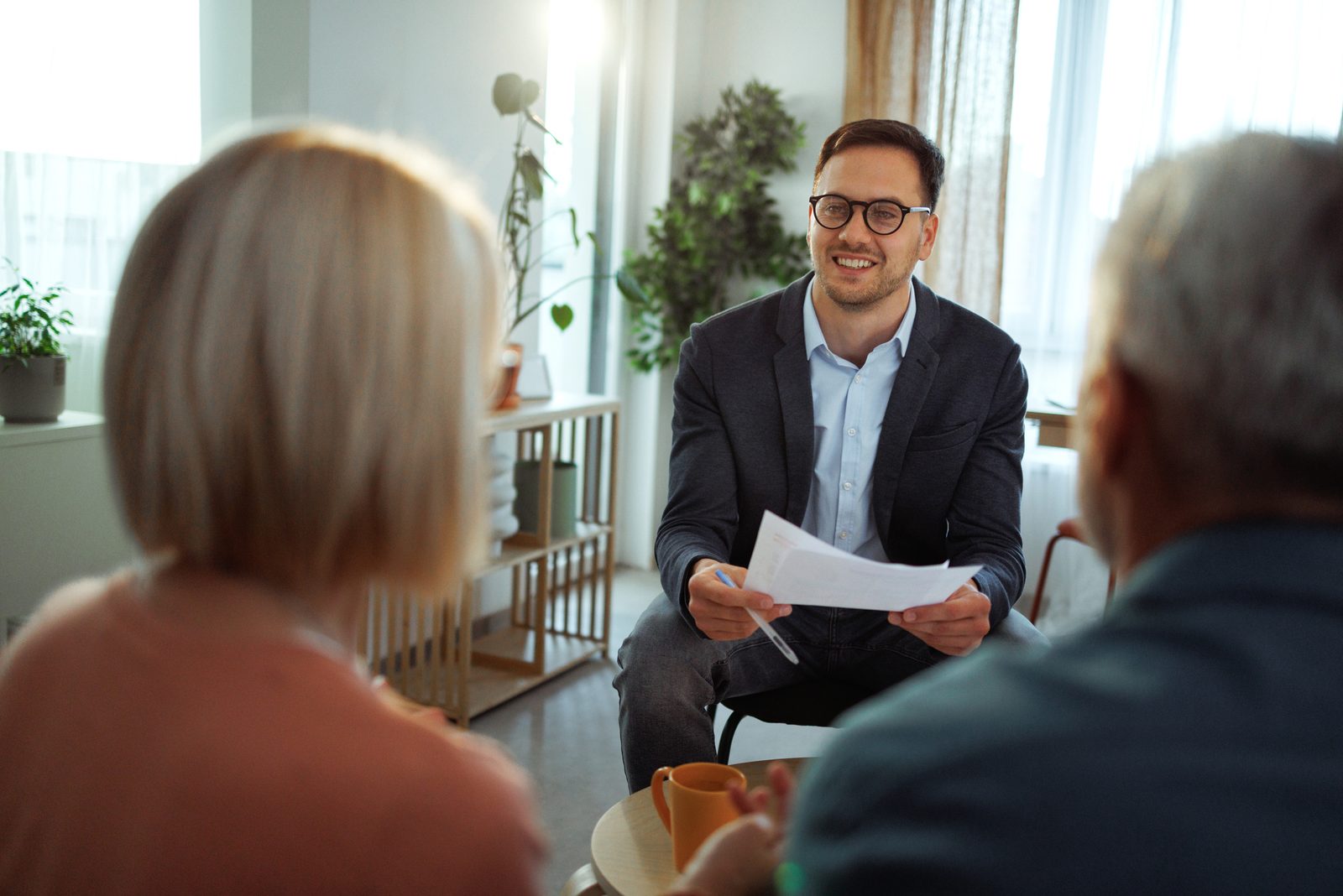 A team member meeting with a resident and her family