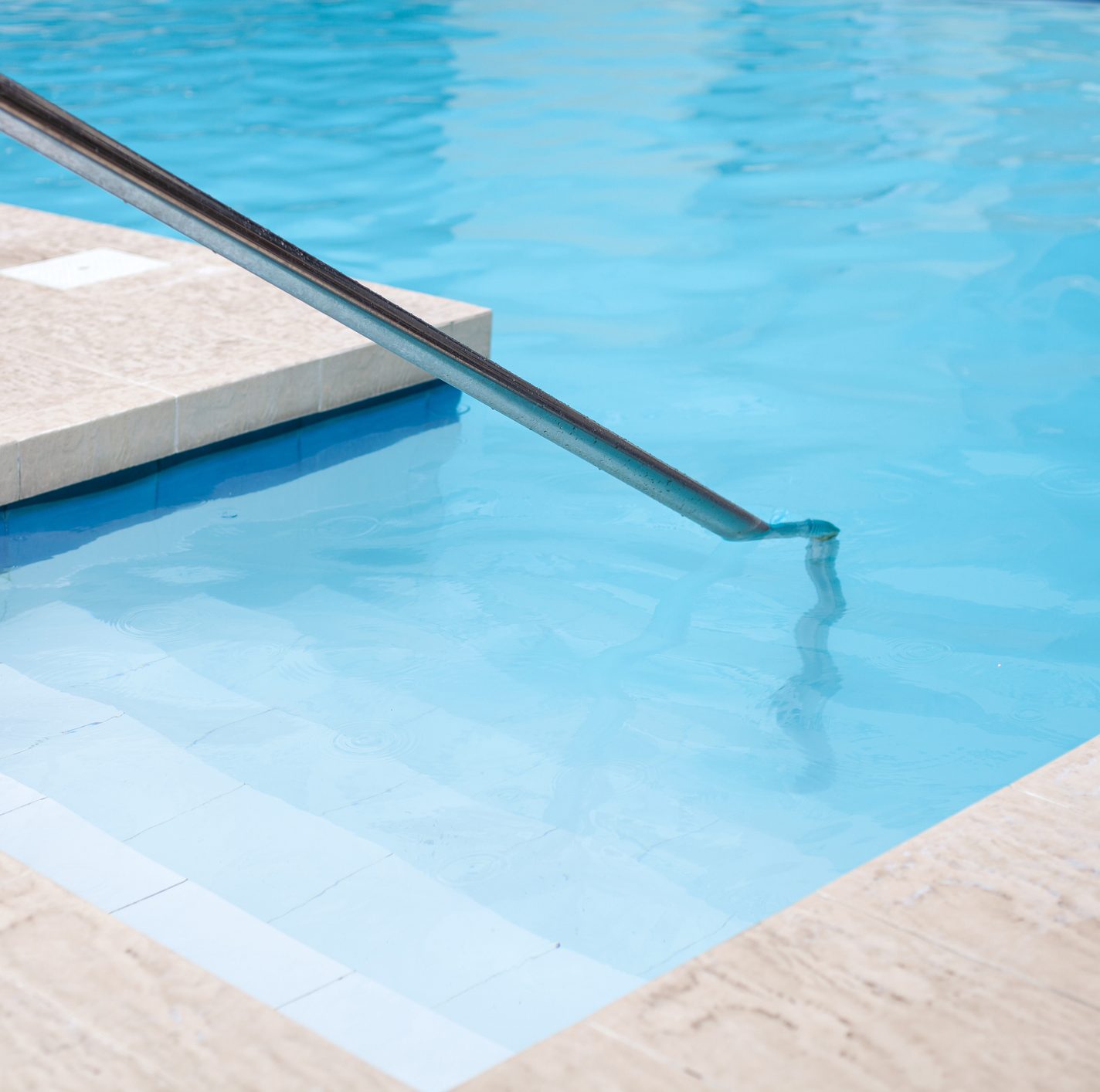 Steps and handrail leading into the heated saltwater pool