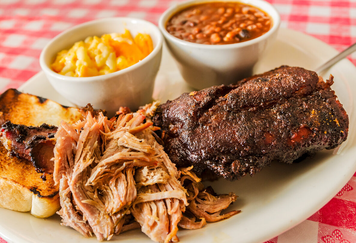 a plate of barbeque and sides